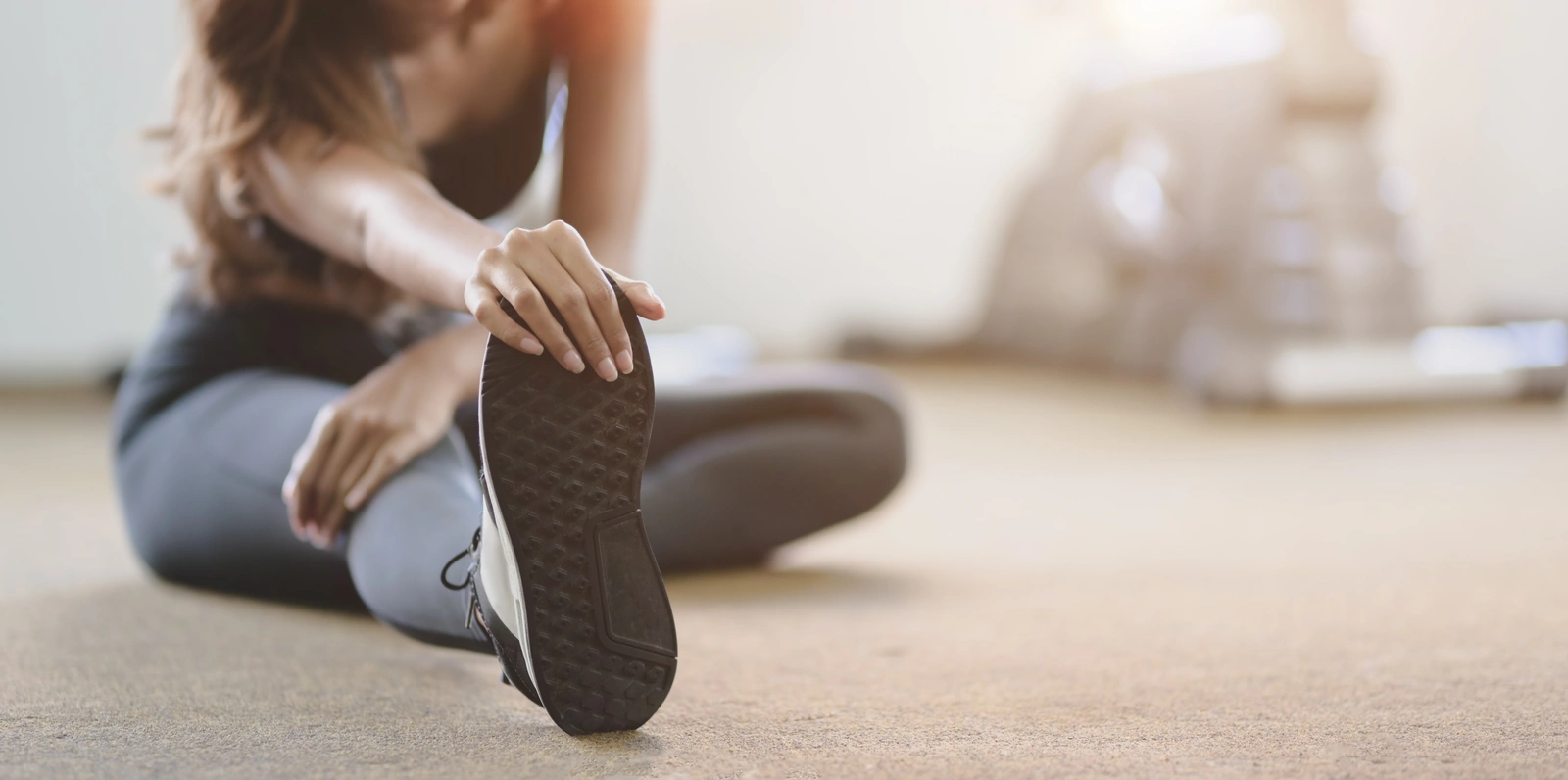 a woman stretching to warm up for exercise