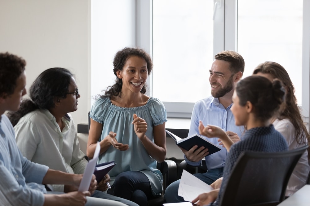 Happy people in group therapy.