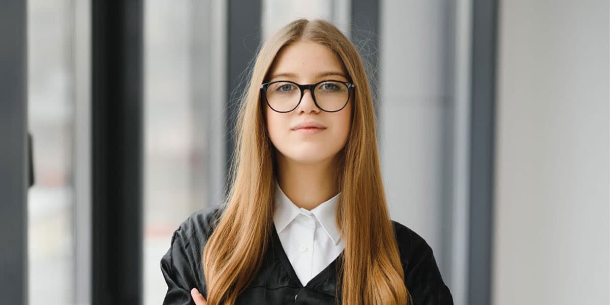 What Is A Sponsor? A woman with glasses standing facing the camera